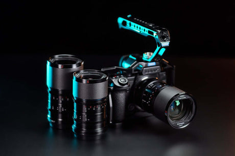 Sony APSC camera with two video lenses and a rig, showcasing equipment for budget cinematic photography.