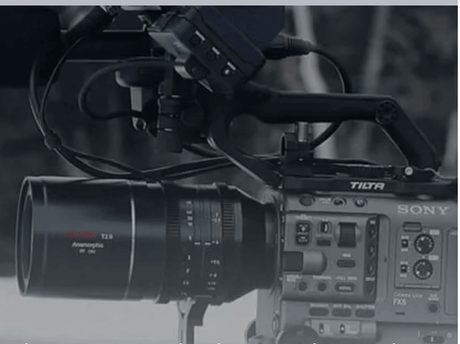 Close-up of a Sony camera with an anamorphic lens showcasing filmmaking equipment.