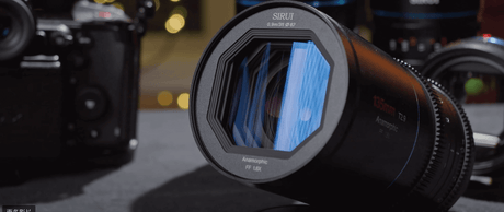 Sirui 135mm T2.9 1.8X anamorphic lens showcasing its unique hexagonal design and blue coating.