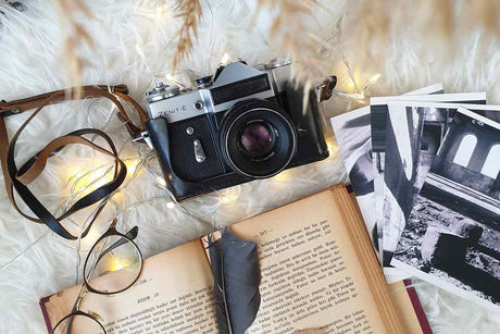 Best Camera for Movie Production | High-Value Models for Beginners with vintage camera, photos, and book.