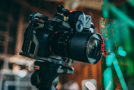 Close-up of a camera with a videography lens, ideal for filmmaking and nature content.