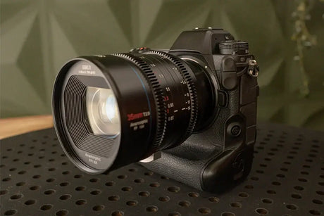 Close-up of a professional camera with a large lens, ideal for wildlife photography.