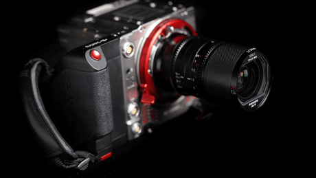 Close-up of a high-quality camera with a red and black design, showcasing its lens and details.